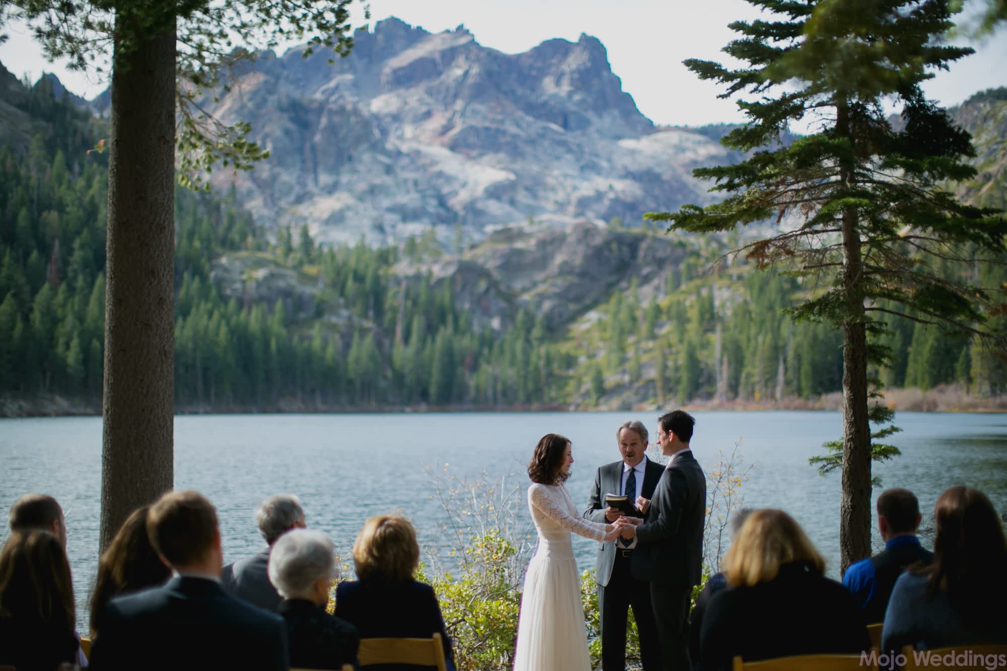 Another lovely ceremony photo showing off the lake in the background.